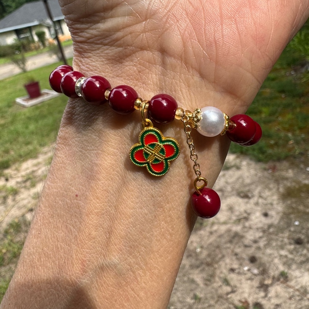 Fashion Inspired, CLOVER CHARM Elegant Chinese red 
 Bracelet with Gold Charm